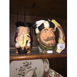 A Royal Doulton large jug - The Trapper (Canadian Centenniel series), and Jolly Toby Catalogue only,