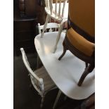 A white kitchen table with three spindle back chairs Catalogue only, live bidding available via