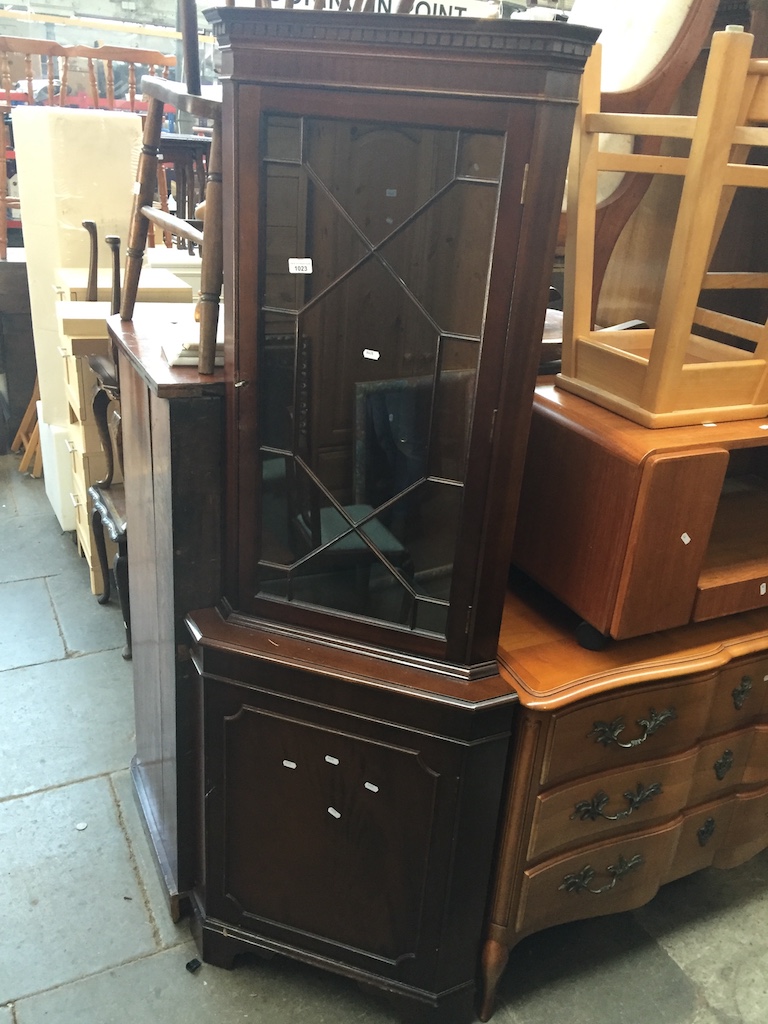 A corner display cabinet Catalogue only, live bidding available via our website. If you require P&