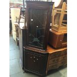 A corner display cabinet Catalogue only, live bidding available via our website. If you require P&