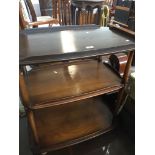 An Ercol dark elm 3 tier trolley Catalogue only, live bidding available via our website. If you