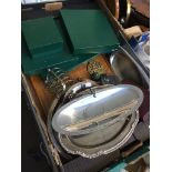 Box of metalware, place mats and a tray Catalogue only, live bidding available via our website. If