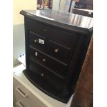 A small side cabinet with drawers Catalogue only, live bidding available via our website. If you