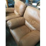 A pair of brown faux leather reclining armchairs Catalogue only, live bidding available via our