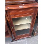 An Edwardian glazed front cabinet Catalogue only, live bidding available via our website. If you