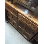 An oak sideboard Catalogue only, live bidding available via our website. If you require P&P please