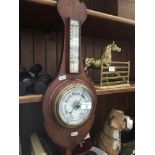 An inlaid barometer Catalogue only, live bidding available via our website. If you require P&P