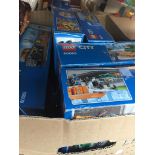 A box of Lego sets Catalogue only, live bidding available via our website. If you require P&P please