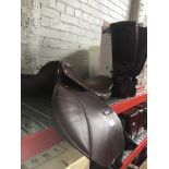 A saddle and riding boots. Catalogue only, live bidding available via our website. If you require