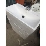 A modern white bathroom sink and two drawer vanity unit with modern chrome tap Catalogue only,