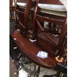 A reproduction mahogany dining table and four chairs Catalogue only, live bidding available via