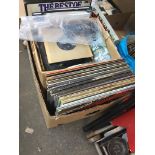 A box of mixed vinyl LPs, singles and books Catalogue only, live bidding available via our