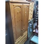 A pine wardrobe Catalogue only, live bidding available via our website. If you require P&P please