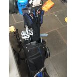 A set of golf clubs in bag with trolley Catalogue only, live bidding available via our website. If