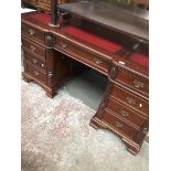 Reproduction pedestal desk with red tooled leather top Catalogue only, live bidding available via