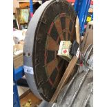 A dartboard with darts. Catalogue only, live bidding available via our website. Please note we can