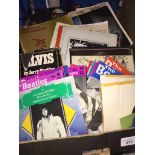 A box of music ephemera to include Beatles, Elvis, etc. Catalogue only, live bidding available via