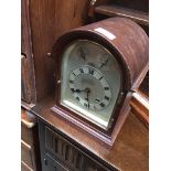 Domed mahogany mantel clock with three train movement Catalogue only, live bidding available via our