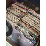 A box of singles records Catalogue only, live bidding available via our website. Please note we