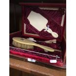 Antique velvet lined cantilever lid box with celluloid backed ladies personal manicure set with