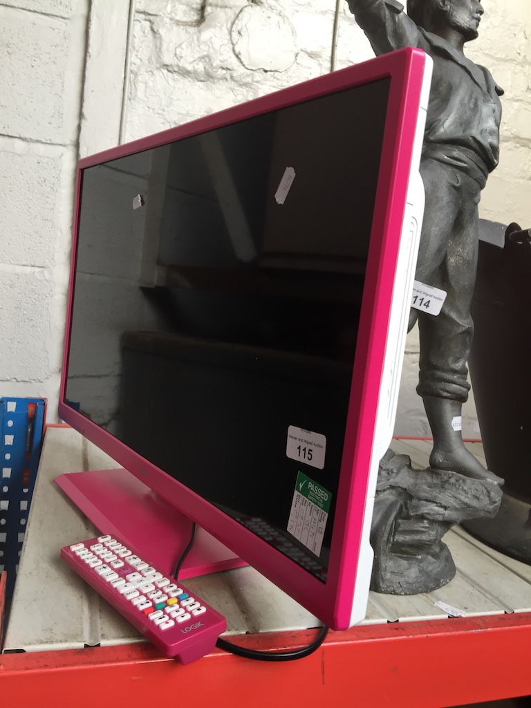 A pink Logik 24" LCD television, with remote Catalogue only, live bidding available via our website.