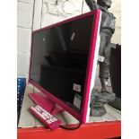 A pink Logik 24" LCD television, with remote Catalogue only, live bidding available via our website.