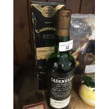 An opened bottle of Cadenhead's Authentic collection of a single malt whisky from the Miltonduff-