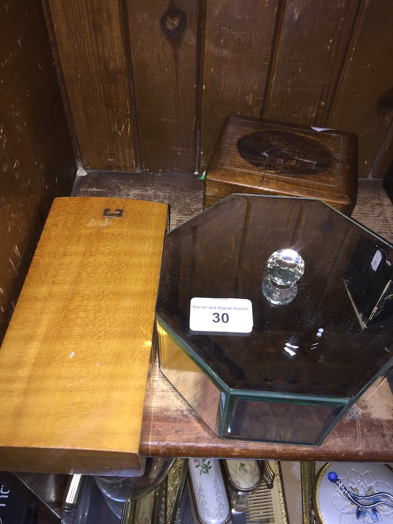 A wooden jewellery box, a wooden Black Forest style musical box and an octagonal glass mirrored