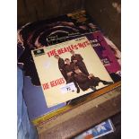 A small quantity of vinyl lps and singles including Rolling Stones, Beatles and Eric Clapton