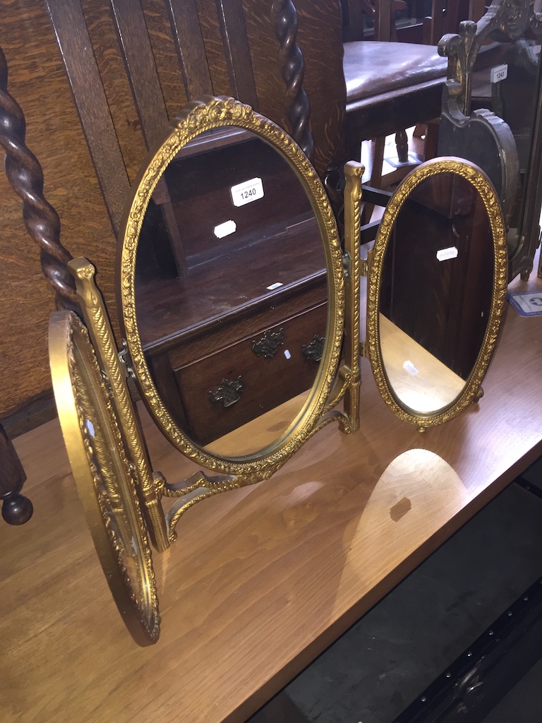 A French style gilded triple dressing table mirror Catalogue only, live bidding available via our