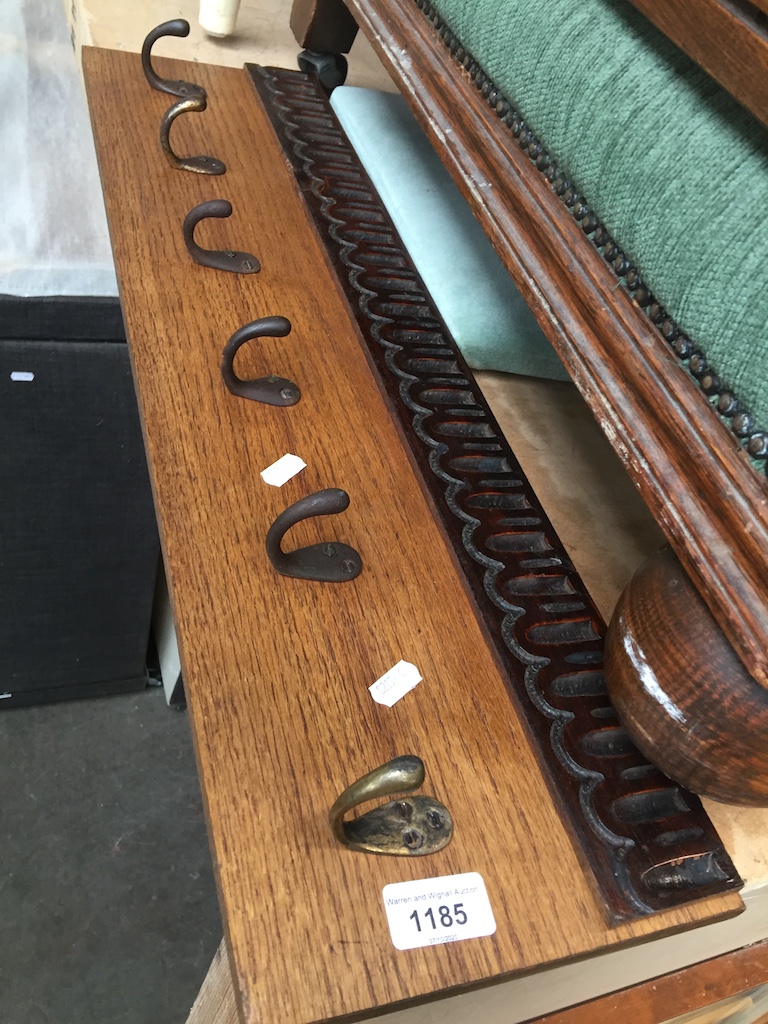 An oak coat rack Catalogue only, live bidding available via our website. Please note we can only