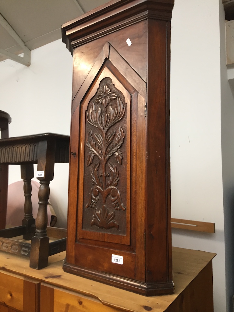 Carved panel corner cupboard Catalogue only, live bidding available via our website. Please note