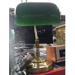 A brass and green glass desk lamp Catalogue only, live bidding available via our website. Please