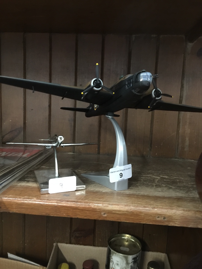 Two model aeroplanes on stands Catalogue only, live bidding available via our website. Please note