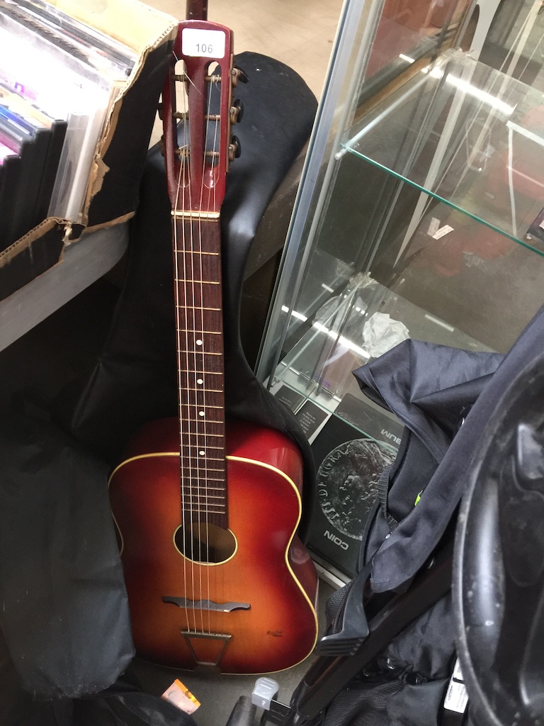 An acoustic guitar Catalogue only, live bidding available via our website. Please note we can only