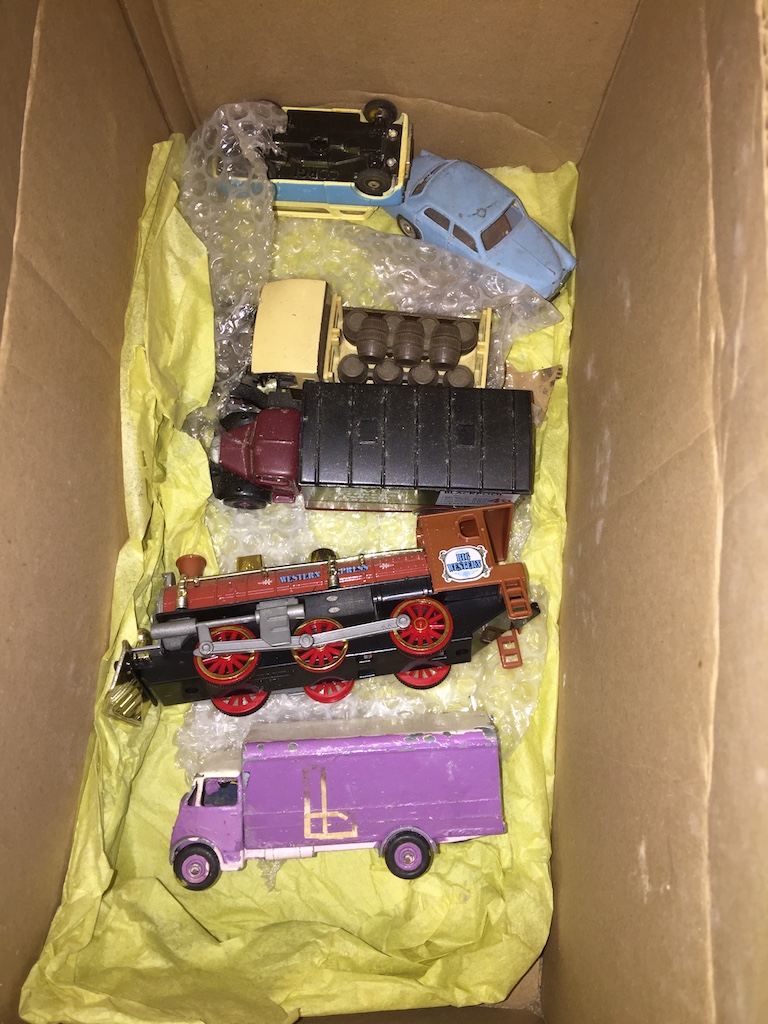 A box of play worn model toys Catalogue only, live bidding available via our website. Please note we