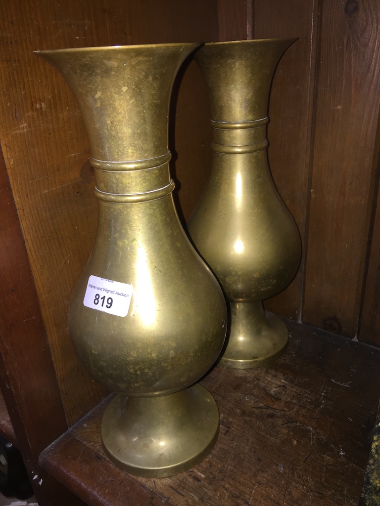 A pair of brass vases, of bulbous form, one with a memorial inscription, height approx 12 inches.