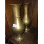 A pair of brass vases, of bulbous form, one with a memorial inscription, height approx 12 inches.