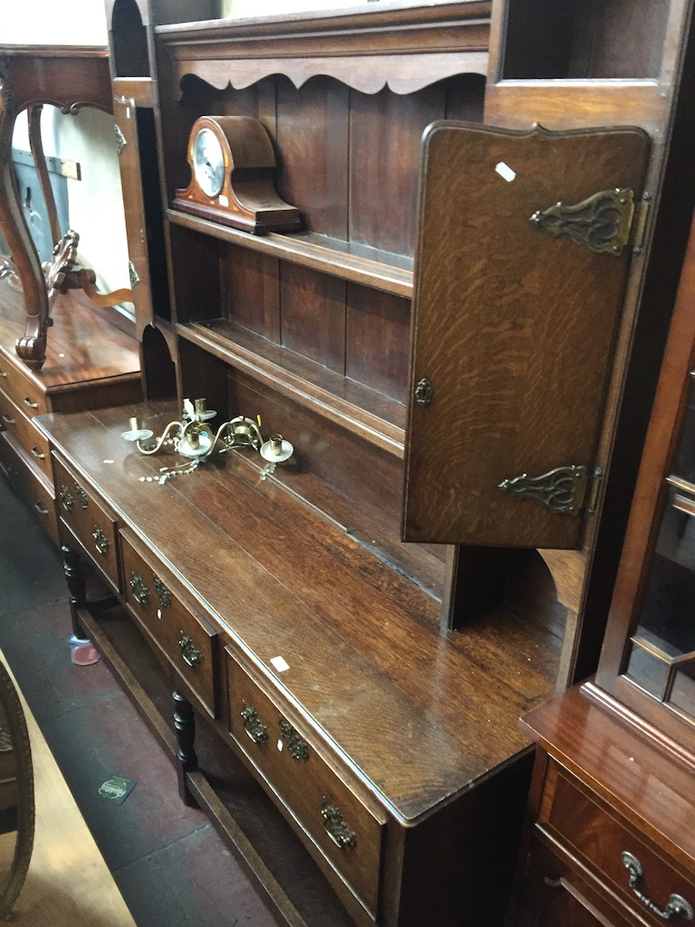An Edwardian oak dressern yhe 18th century style with plate rack back, brass aesthetic handles and