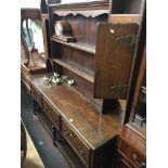 An Edwardian oak dressern yhe 18th century style with plate rack back, brass aesthetic handles and