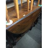 An oak drop leaf table Catalogue only, live bidding available via our website. Please note we can