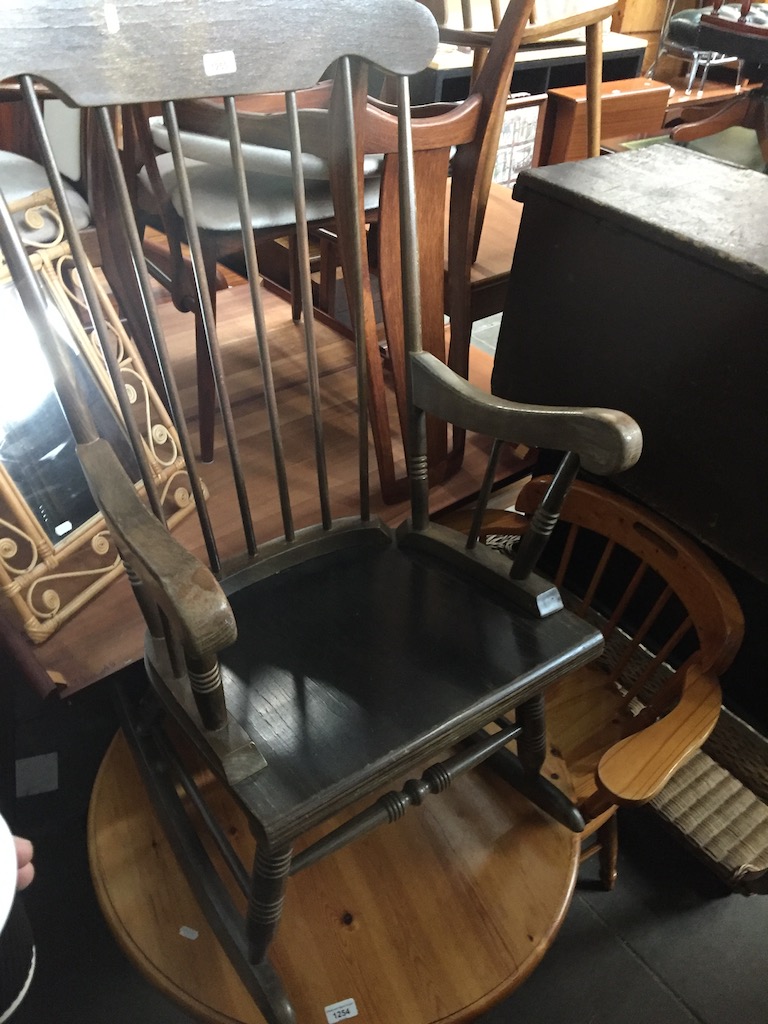 A spindle back rocker Catalogue only, live bidding available via our website. Please note we can