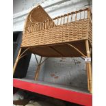 A wicker crib with mattress, drapes etc Catalogue only, live bidding available via our website.