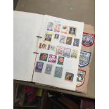 An album of stamps and cloth badges Catalogue only, live bidding available via our website. Please
