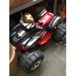 A childs battery powered Quad Bike complete with charger Catalogue only, live bidding available