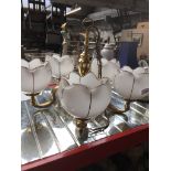 A Brass chandelier Catalogue only, live bidding available via our website. Please note we can only