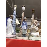A group of 3 pottery figural table lamps including 2 Nao. Catalogue only, live bidding available via
