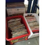 Two boxes of 7" vinyl singles and a box of LPs Catalogue only, live bidding available via our