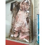 A Doll in a presentation box Catalogue only, live bidding available via our website. Please note