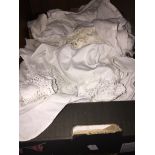 A box of mainly Victorian / Edwardian clothing to include tops, christening gowns, WW2 era clothing,